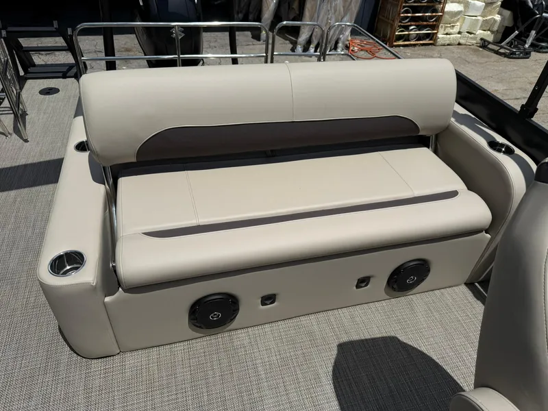 Slide: The Image of 2026 Bentley Pontoons Legacy 243 Swingback interior seating with cup holders and speakers. - 12