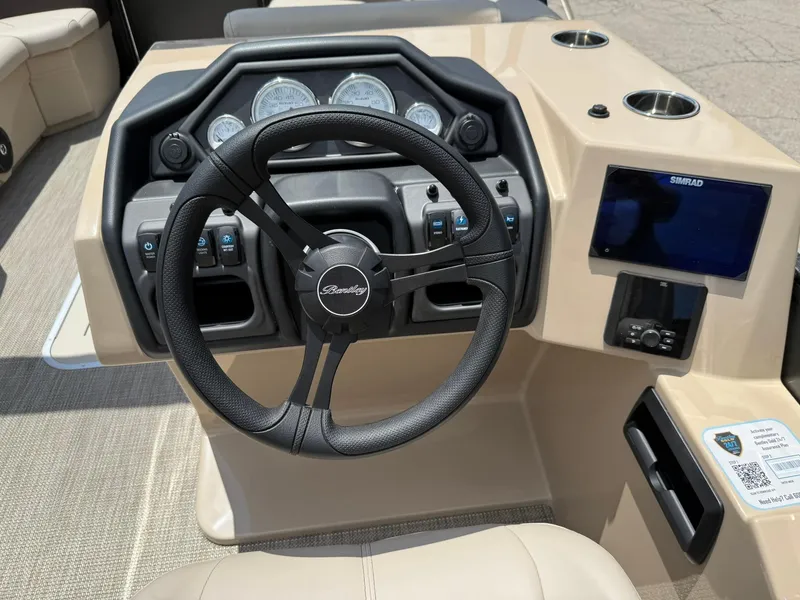 Slide: The Image of 2026 Bentley Pontoons Legacy 243 Swingback dashboard with steering wheel and control panel. - 9