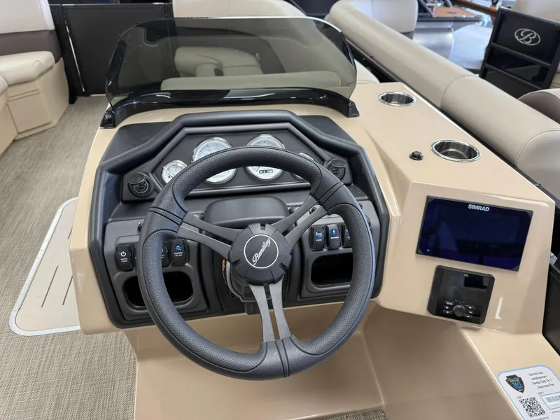 Slide: The Image of Steering console of 2026 Bentley Pontoons Legacy 243 Navigator with modern controls and display. - 6
