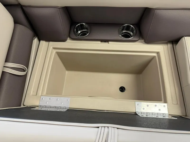 Slide: The Image of Interior storage compartment of 2026 Bentley Pontoons Legacy 243 Navigator with cup holders. - 9