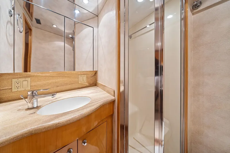 Slide: The Image of Luxurious bathroom in 2002 Hatteras 60 Convertible yacht with modern fixtures and shower. - 18