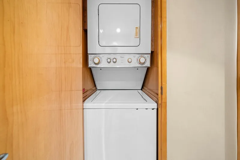 Slide: The Image of Stacked washer and dryer in 2002 Hatteras 60 Convertible yacht interior. - 23