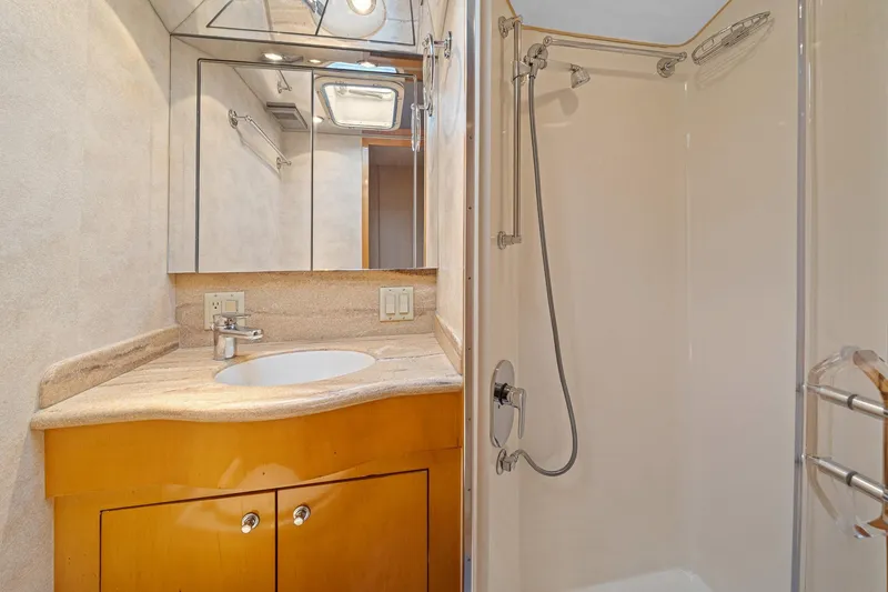 Slide: The Image of Bathroom interior of 2002 Hatteras 60 Convertible yacht with shower and vanity. - 24