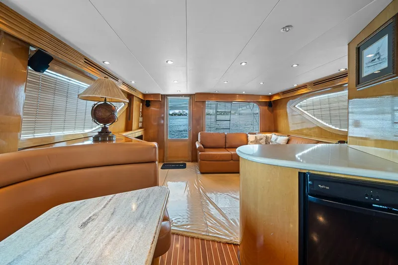 Slide: The Image of Luxurious interior of 2002 Hatteras 60 Convertible yacht with elegant furnishings and modern design. - 25