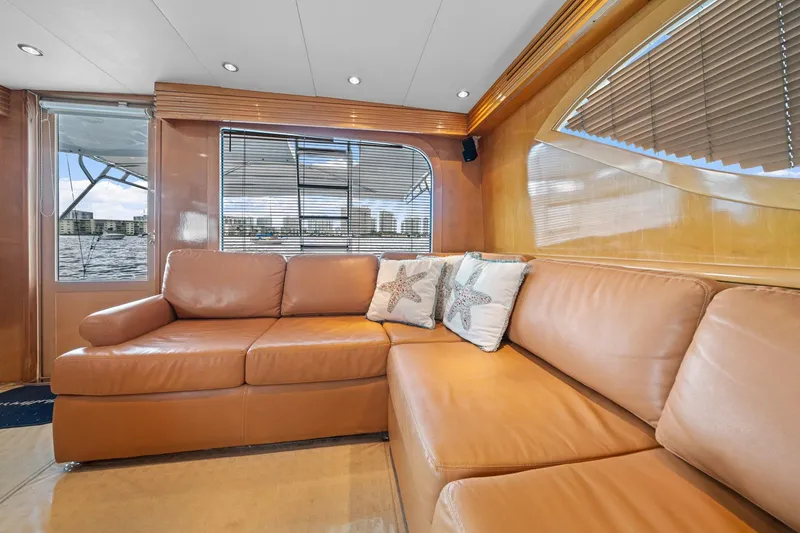 Slide: The Image of Luxurious interior of 2002 Hatteras 60 Convertible yacht with leather seating and starfish pillows. - 31
