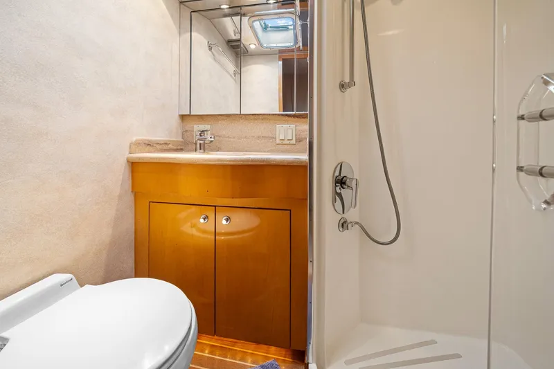 Slide: The Image of Bathroom interior of 2002 Hatteras 60 Convertible yacht with shower and vanity. - 34