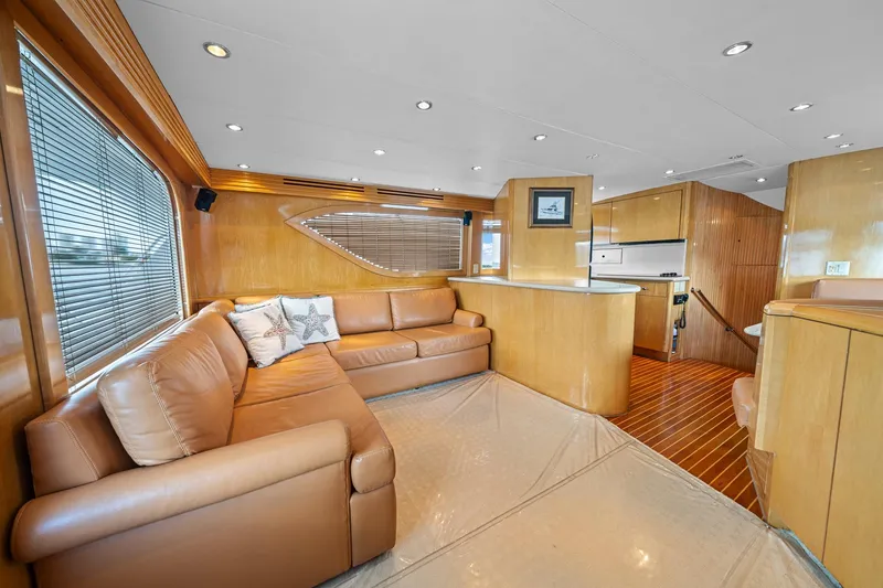 Slide: The Image of Luxurious interior of 2002 Hatteras 60 Convertible yacht with leather seating and wood finishes. - 41