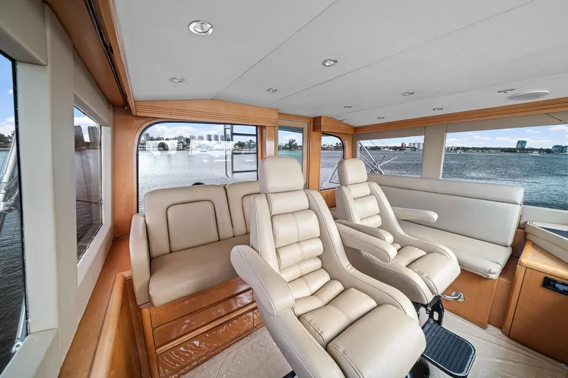 Slide: The Image of Luxurious interior of 2002 Hatteras 60 Convertible yacht with leather seating and panoramic windows. - 43