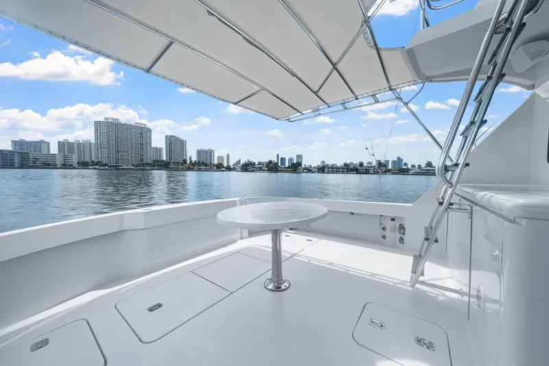 Slide: The Image of 2002 Hatteras 60 Convertible yacht deck with city skyline view. - 58