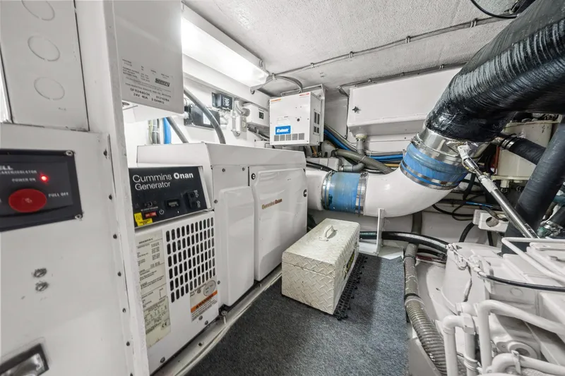 Slide: The Image of Engine room of 2002 Hatteras 60 Convertible with Cummins Onan generator. - 68