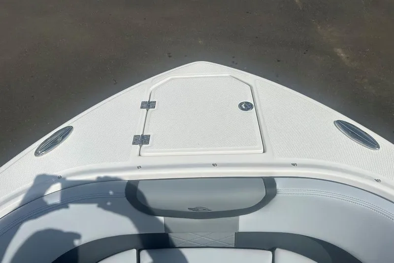 Slide: The Image of Bow of 2026 Chaparral 280 OSX boat with storage hatch and seating. - 15