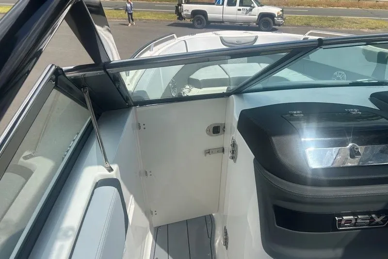 Slide: The Image of 2026 Chaparral 280 OSX boat interior with sleek design and modern features. - 18