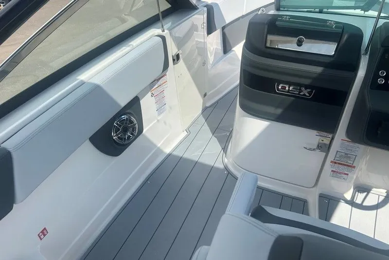 Slide: The Image of 2026 Chaparral 280 OSX boat interior with sleek design and modern features. - 19