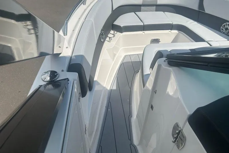 Slide: The Image of 2026 Chaparral 280 OSX boat interior with sleek seating and modern design. - 20