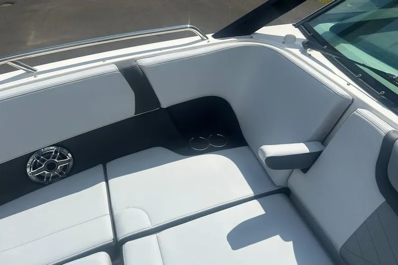 Slide: The Image of 2026 Chaparral 280 OSX boat interior with white seating and speaker detail. - 25