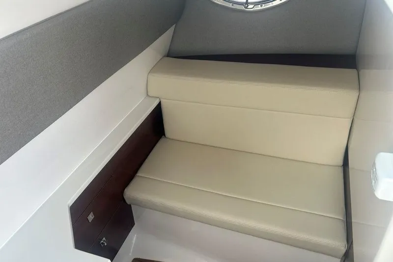 Slide: The Image of 2026 Chaparral 280 OSX interior with beige seating and modern design. - 41