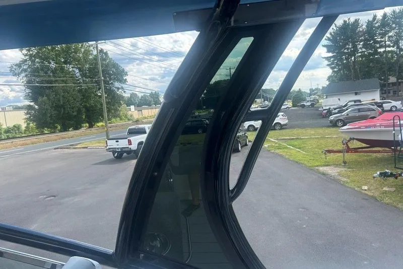 Slide: The Image of View from Chaparral 280 OSX 2026 boat, showing parking lot and vehicles. - 44