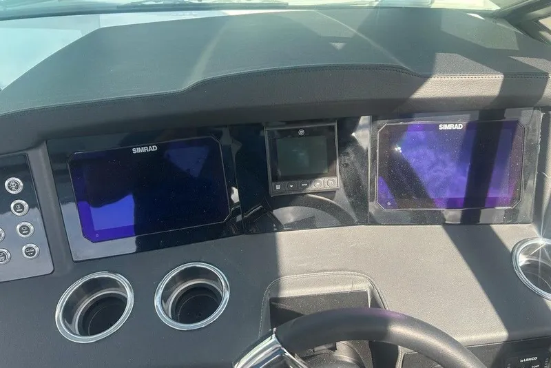 Slide: The Image of Dashboard of 2026 Chaparral 280 OSX boat with Simrad displays and controls. - 49