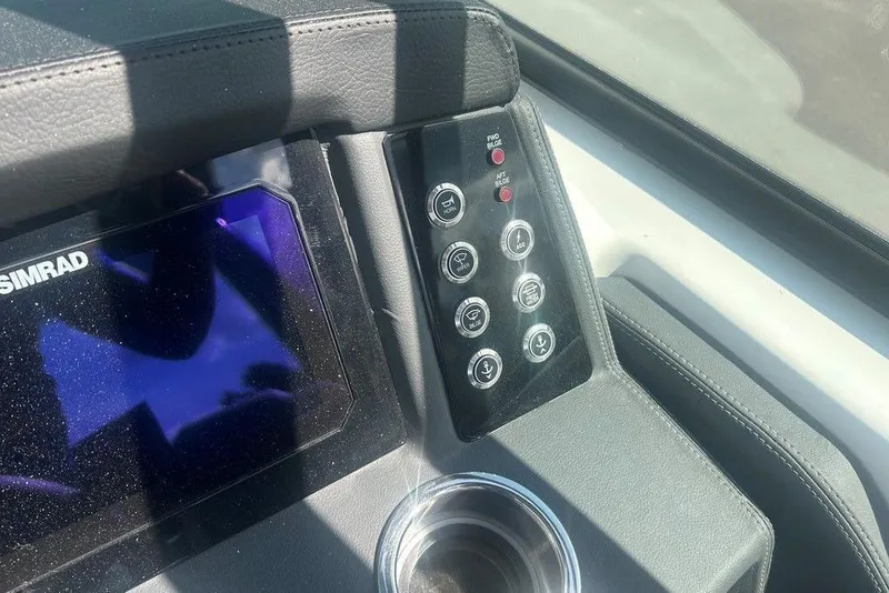 Slide: The Image of Control panel of 2026 Chaparral 280 OSX boat with Simrad display and buttons. - 50