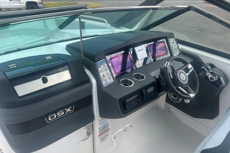 Slide: The Image of 2026 Chaparral 280 OSX boat dashboard with modern controls and sleek design. - 51