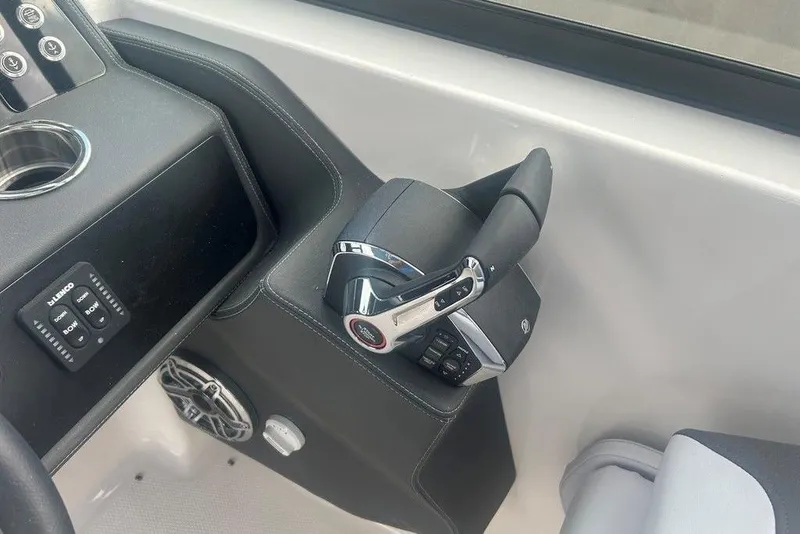 Slide: The Image of 2026 Chaparral 280 OSX boat helm with modern controls and sleek design. - 58