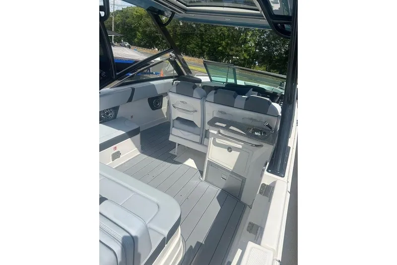Slide: The Image of 2026 Chaparral 280 OSX boat interior with sleek seating and modern design. - 60