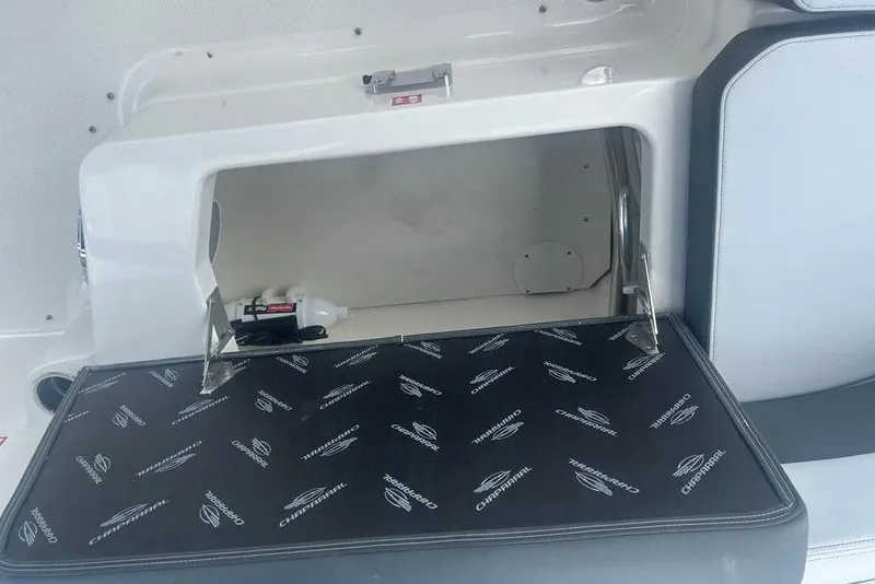 Slide: The Image of Open storage compartment in 2026 Chaparral 280 OSX boat interior. - 70