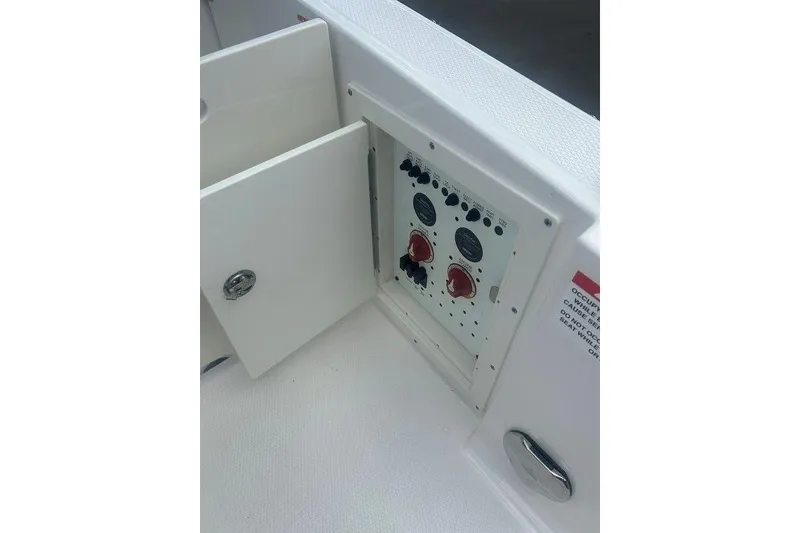 Slide: The Image of Control panel on 2026 Chaparral 280 OSX boat, featuring switches and dials. - 75
