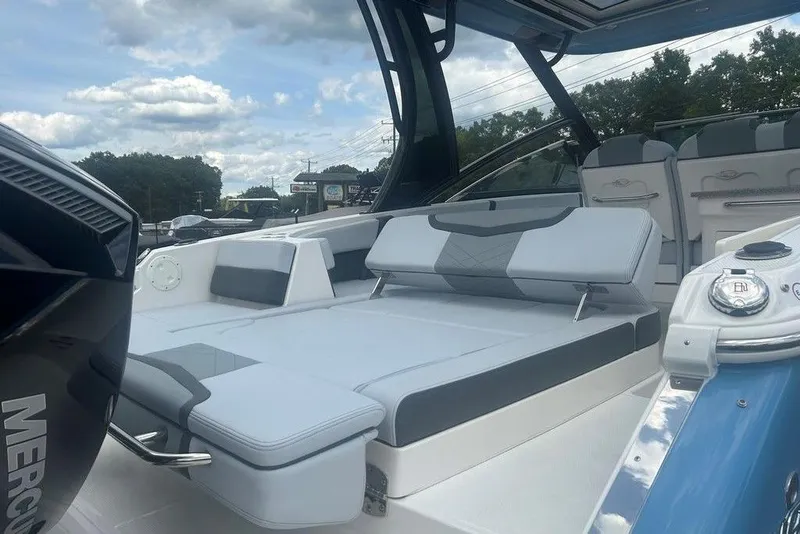 Slide: The Image of 2026 Chaparral 280 OSX boat interior with luxurious seating and modern design. - 77