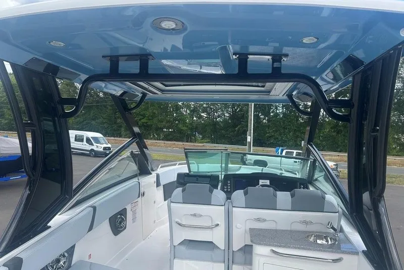 Slide: The Image of 2026 Chaparral 280 OSX boat interior with seating and modern amenities. - 9