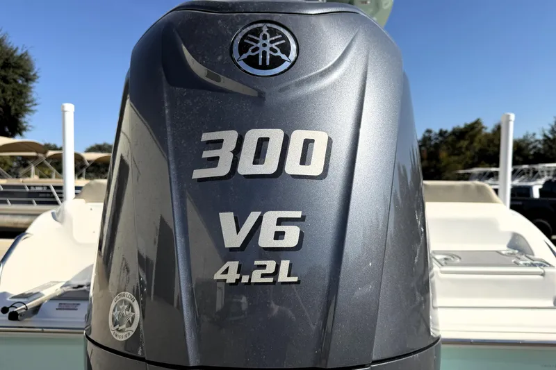 Slide: The Image of 2025 Key West 239 FS boat with Yamaha 300 V6 4.2L engine, rear view. - 13