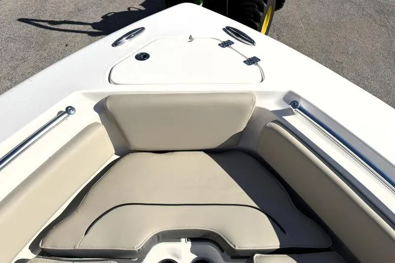 Slide: The Image of 2025 Key West 239 FS boat interior with beige seating and stainless steel rails. - 23