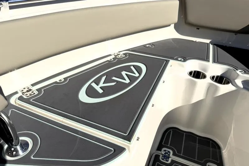 Slide: The Image of 2025 Key West 239 FS boat interior with KW logo and cup holders. - 25