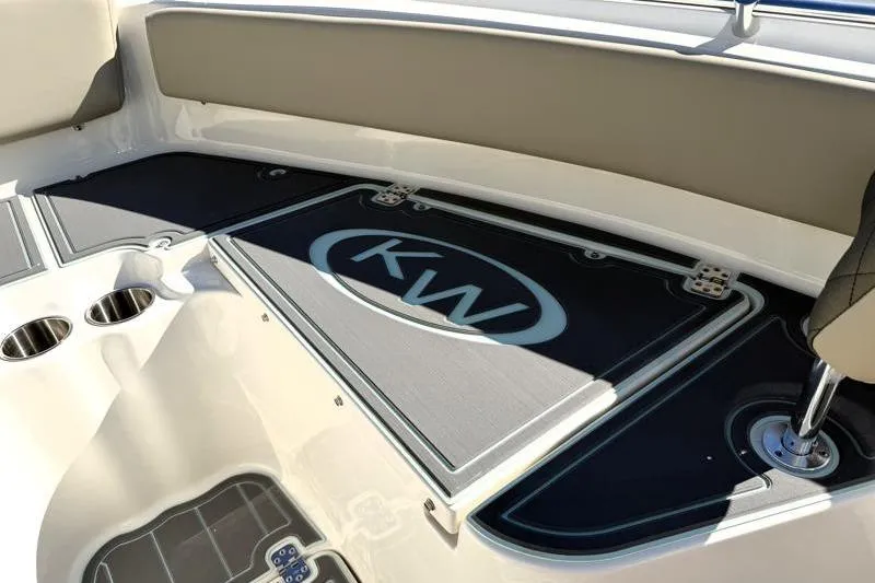 Slide: The Image of 2025 Key West 239 FS boat interior with KW logo and cup holders. - 26