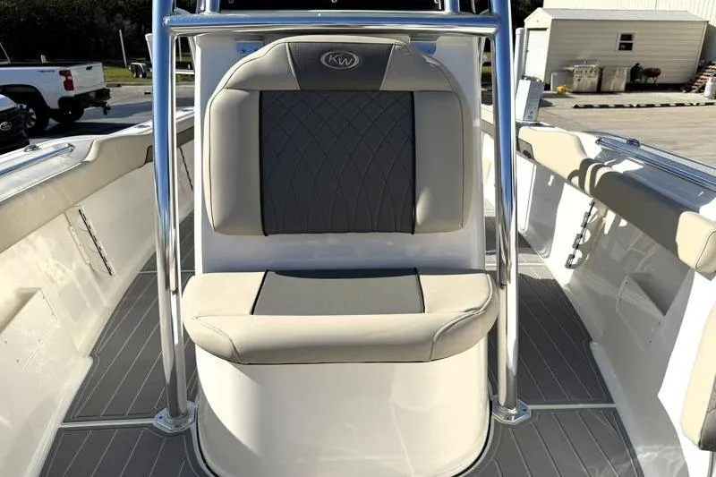 Slide: The Image of 2025 Key West 239 FS boat interior with cushioned seating and sleek design. - 28