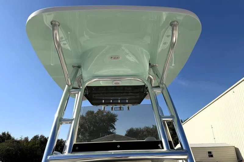 Slide: The Image of 2025 Key West 239 FS boat T-top with stainless steel frame under clear blue sky. - 29