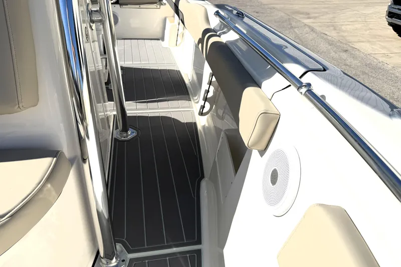 Slide: The Image of 2025 Key West 239 FS boat interior with cushioned seating and sleek design. - 31