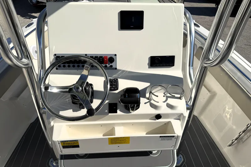 Slide: The Image of 2025 Key West 239 FS boat console with steering wheel and controls. - 34