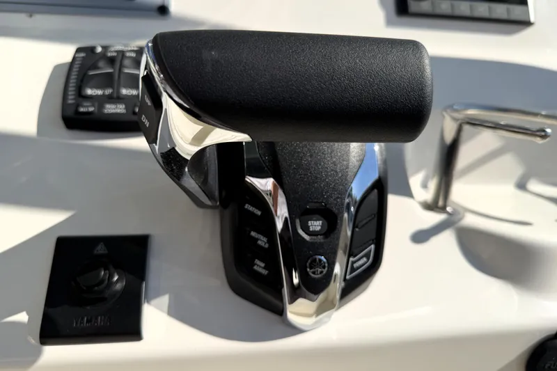 Slide: The Image of Throttle control on 2025 Key West 239 FS boat dashboard, featuring Yamaha components. - 35