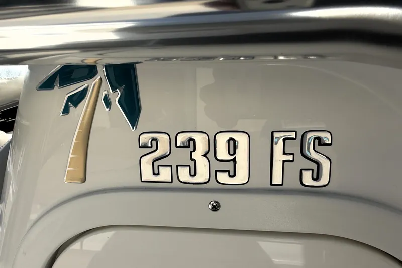 Slide: The Image of 2025 Key West 239 FS boat emblem with palm tree design. - 40