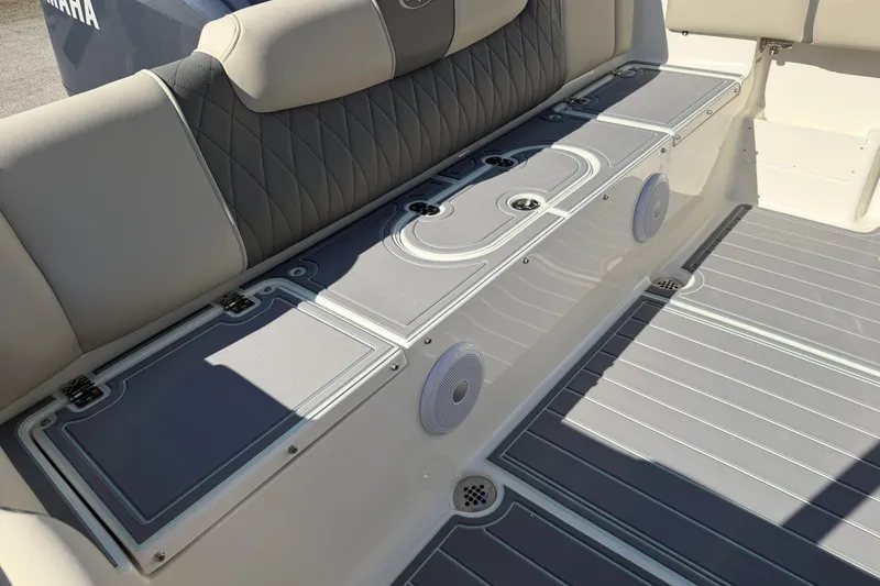 Slide: The Image of 2025 Key West 239 FS boat interior with cushioned seating and storage compartments. - 44