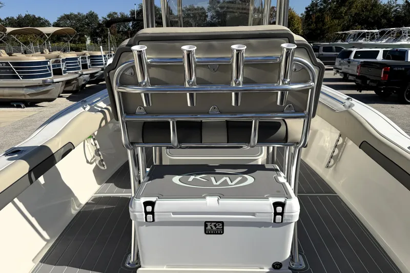 Slide: The Image of 2025 Key West 239 FS boat interior with rod holders and cooler on deck. - 46