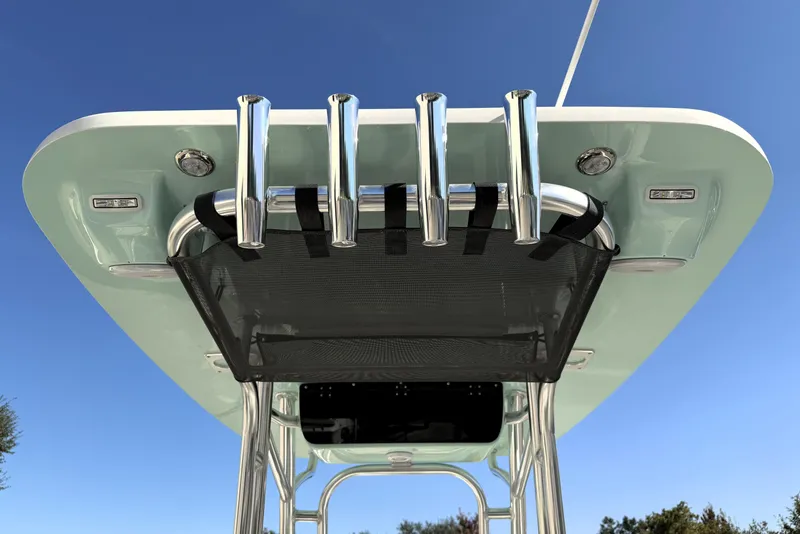 Slide: The Image of 2025 Key West 239 FS boat top view with rod holders against clear blue sky. - 47