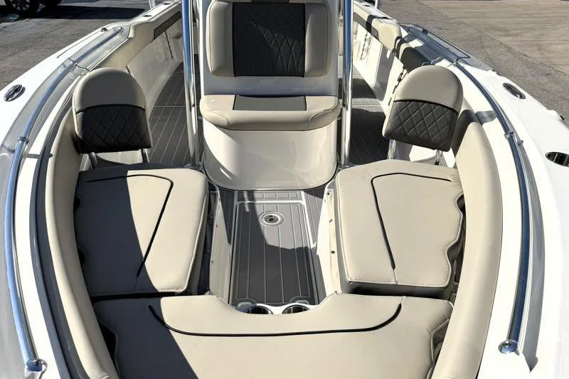 Slide: The Image of 2025 Key West 239 FS boat interior with beige seating and sleek design. - 7