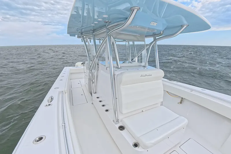 Slide: The Image of 2019 SeaHunter 33 Tournament boat on open water, featuring sleek design and spacious deck. - 13