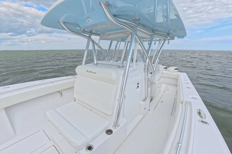 Slide: The Image of 2019 SeaHunter 33 Tournament boat on open water, featuring sleek design and spacious deck. - 16