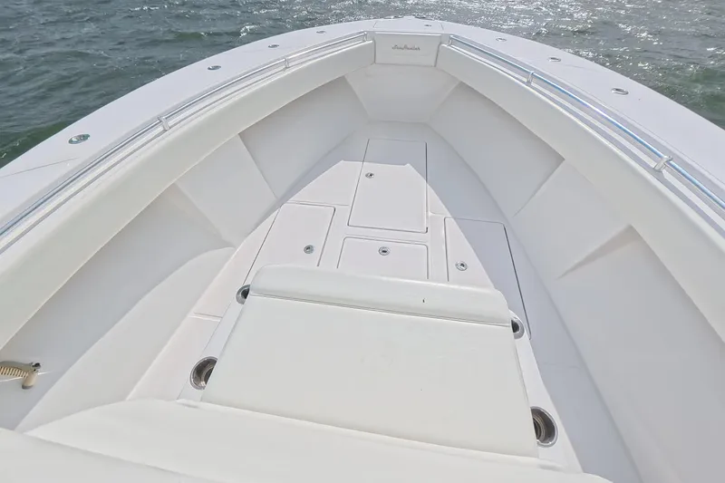 Slide: The Image of 2019 SeaHunter 33 Tournament boat deck with sleek white design on open water. - 18