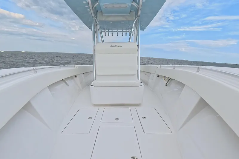 Slide: The Image of 2019 SeaHunter 33 Tournament boat on open water under blue sky. - 19