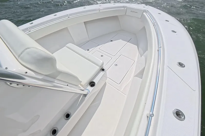Slide: The Image of 2019 SeaHunter 33 Tournament boat, white interior, spacious seating, sleek design, ocean backdrop. - 20