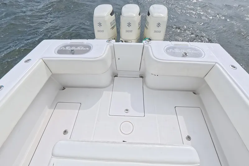 Slide: The Image of 2019 SeaHunter 33 Tournament boat deck with triple Suzuki outboard engines. - 28